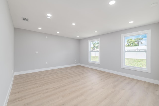 2058 SE Watercrest St, Port Saint Lucie, FL 34984 - empty room featuring plenty of natural light, light wood finished floors, and recessed lighting