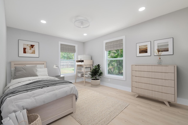 2058 SE Watercrest St, Port Saint Lucie, FL 34984 - bedroom featuring wood finished floors and recessed lighting