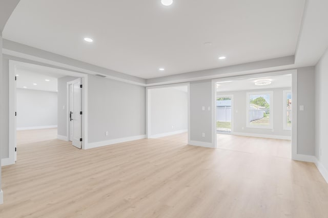 2058 SE Watercrest St, Port Saint Lucie, FL 34984 - unfurnished living room featuring light wood-style flooring and recessed lighting