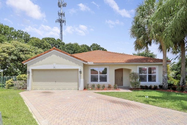 1466 Artimino Ln, Boynton Beach, FL 33436 - view of front of home with decorative driveway, a garage, a tile roof, and stucco siding