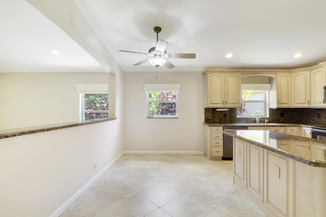 1466 Artimino Ln, Boynton Beach, FL 33436 - kitchen featuring stainless steel dishwasher, plenty of natural light, decorative backsplash, dark stone counters, and recessed lighting