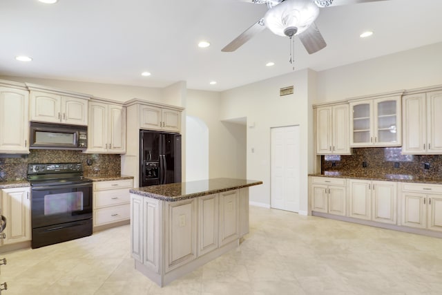 1466 Artimino Ln, Boynton Beach, FL 33436 - kitchen featuring black appliances, backsplash, dark stone counters, a ceiling fan, and a kitchen island