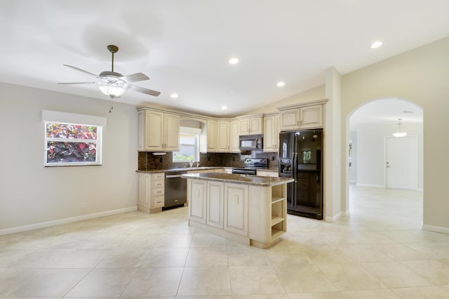 1466 Artimino Ln, Boynton Beach, FL 33436 - kitchen with black appliances, arched walkways, a kitchen island, tasteful backsplash, and ceiling fan