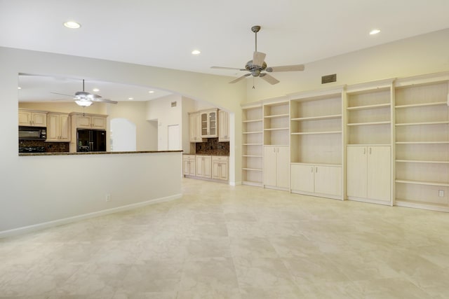 1466 Artimino Ln, Boynton Beach, FL 33436 - unfurnished living room featuring ceiling fan, arched walkways, and recessed lighting