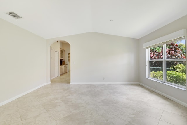1466 Artimino Ln, Boynton Beach, FL 33436 - unfurnished room featuring lofted ceiling and arched walkways