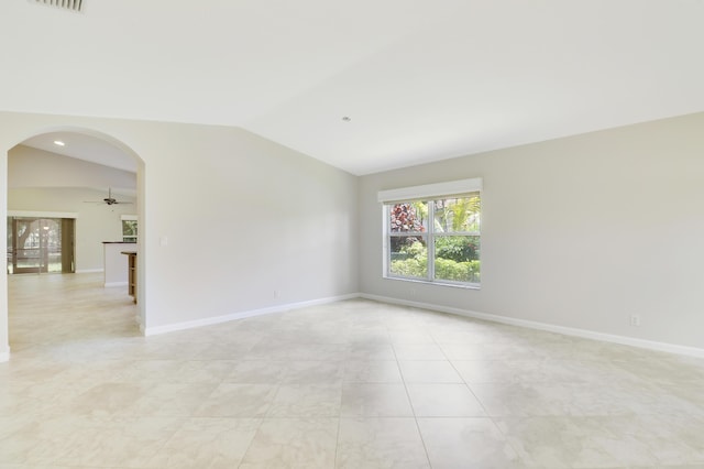 1466 Artimino Ln, Boynton Beach, FL 33436 - spare room with vaulted ceiling, arched walkways, light tile patterned flooring, and a ceiling fan