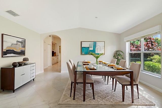 1466 Artimino Ln, Boynton Beach, FL 33436 - dining room featuring arched walkways and vaulted ceiling