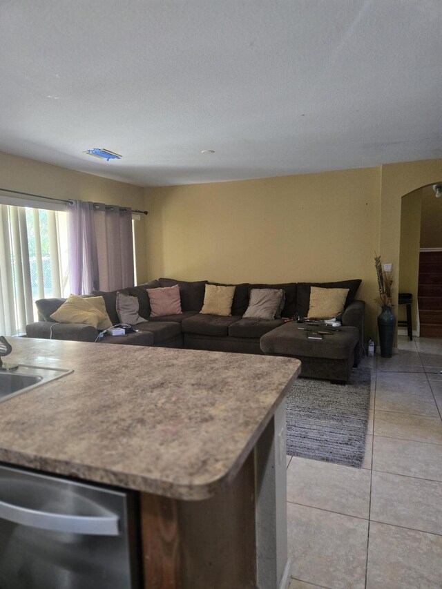 2137 Little Torch St, Riviera Beach, FL 33407 - living room with light tile patterned floors and arched walkways