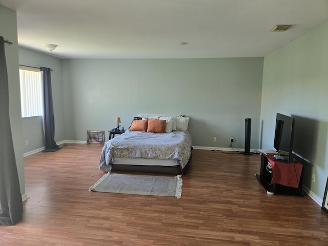2137 Little Torch St, Riviera Beach, FL 33407 - bedroom featuring wood finished floors and baseboards