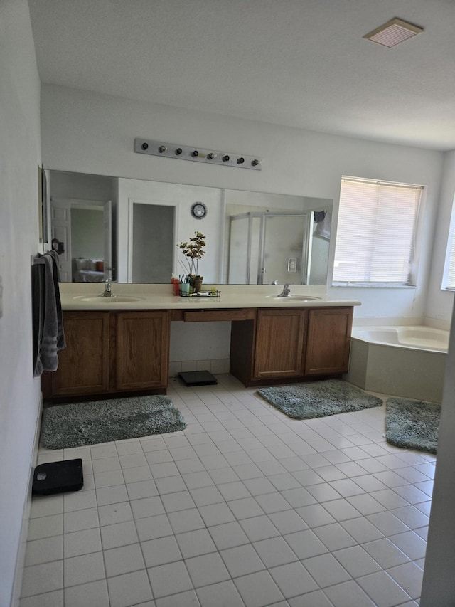 2137 Little Torch St, Riviera Beach, FL 33407 - full bathroom featuring double vanity, a garden tub, and tile patterned floors
