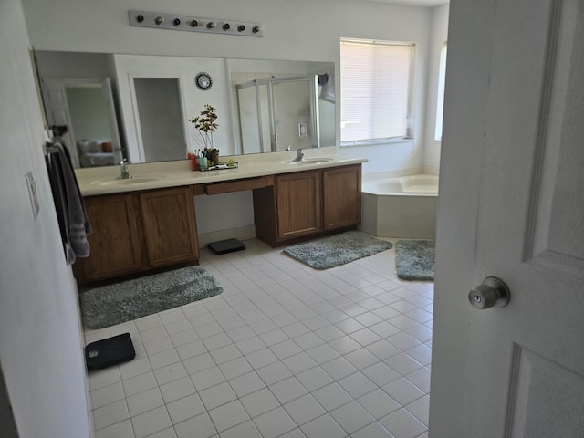 2137 Little Torch St, Riviera Beach, FL 33407 - full bath featuring a shower stall, a bath, double vanity, and tile patterned floors