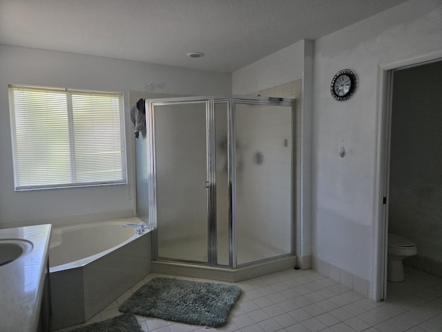 2137 Little Torch St, Riviera Beach, FL 33407 - full bathroom featuring a shower stall, tile patterned floors, a garden tub, and a textured ceiling
