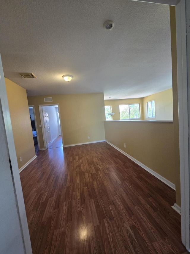 2137 Little Torch St, Riviera Beach, FL 33407 - empty room with dark wood finished floors and a textured ceiling