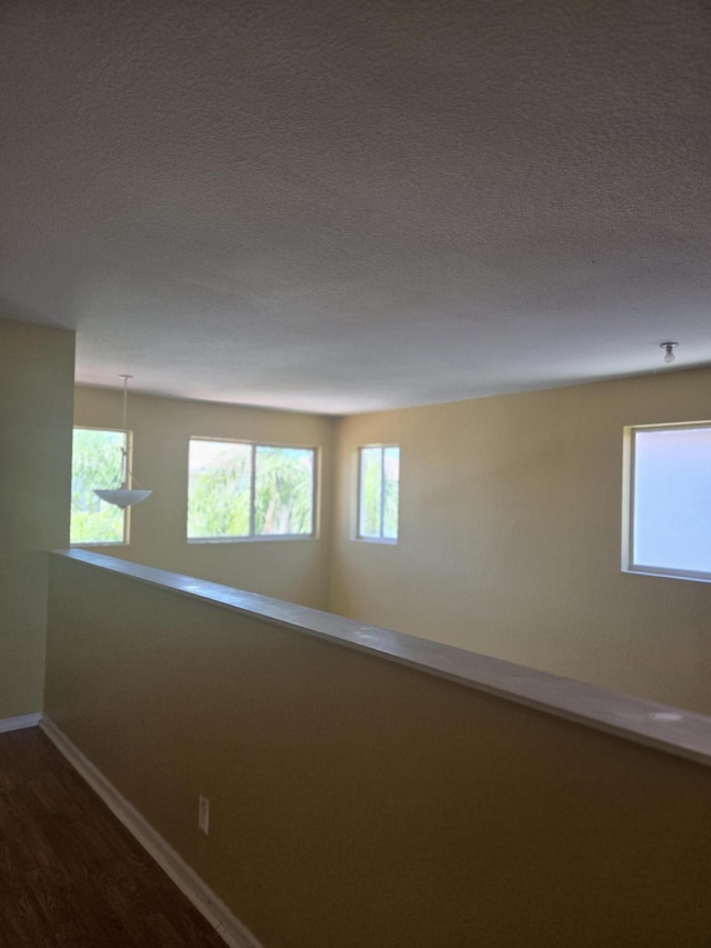 2137 Little Torch St, Riviera Beach, FL 33407 - spare room with dark wood-type flooring and a textured ceiling