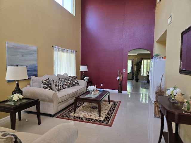 2137 Little Torch St, Riviera Beach, FL 33407 - living area featuring arched walkways and a high ceiling