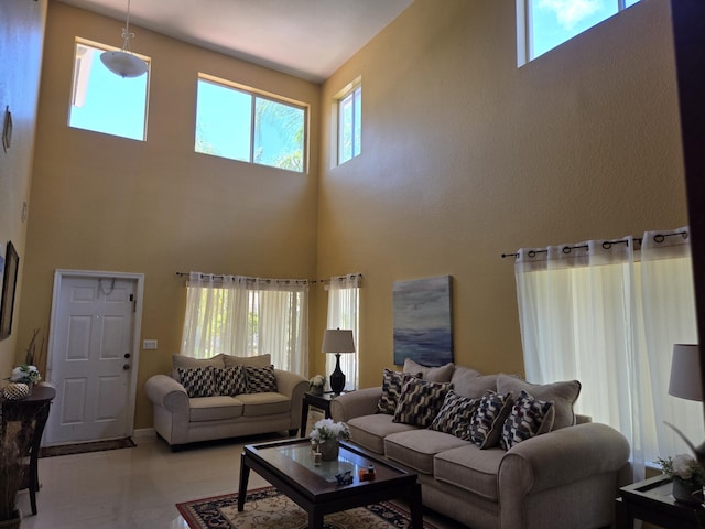 2137 Little Torch St, Riviera Beach, FL 33407 - living area featuring a high ceiling and healthy amount of natural light