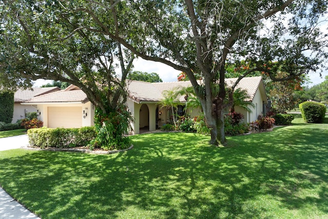 166 Bayberry Cir, Jupiter, FL 33458 - single story home featuring a tile roof, stucco siding, an attached garage, and a front lawn