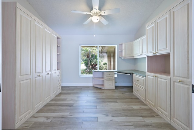 166 Bayberry Cir, Jupiter, FL 33458 - unfurnished office featuring a ceiling fan, built in study area, a textured ceiling, lofted ceiling, and light wood-type flooring