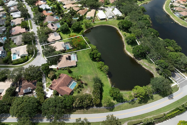 166 Bayberry Cir, Jupiter, FL 33458 - aerial perspective of suburban area with a large body of water and property parcel outlined