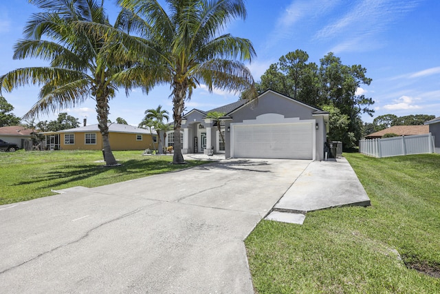 421 NW Cornell Ave, Port Saint Lucie, FL 34983 - single story home featuring a garage, concrete driveway, and stucco siding
