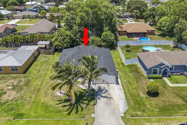 421 NW Cornell Ave, Port Saint Lucie, FL 34983 - aerial perspective of suburban area featuring a pool