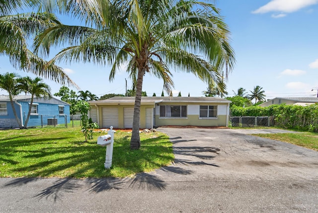 4364 N Mary Cir, Palm Beach Gardens, FL 33410 - view of front of home with asphalt driveway