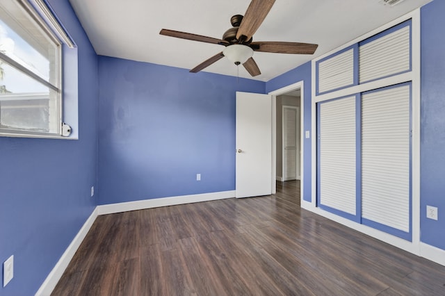 4364 N Mary Cir, Palm Beach Gardens, FL 33410 - unfurnished bedroom with wood finished floors and ceiling fan