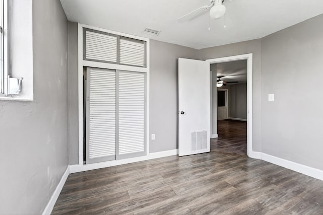 4364 N Mary Cir, Palm Beach Gardens, FL 33410 - unfurnished bedroom featuring wood finished floors, a closet, and ceiling fan