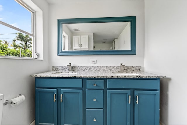4364 N Mary Cir, Palm Beach Gardens, FL 33410 - bathroom featuring double vanity and toilet