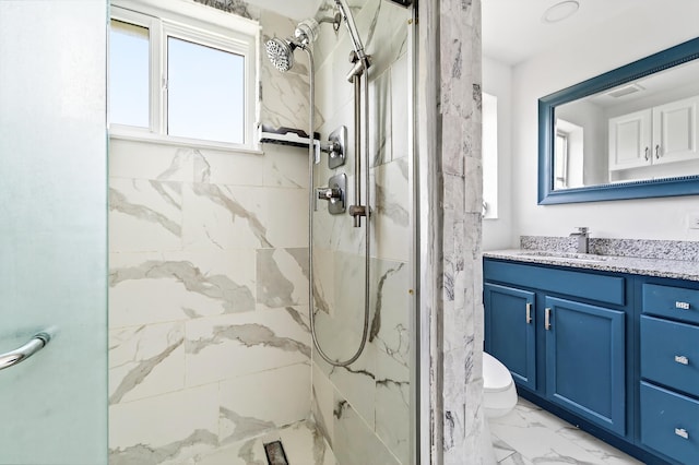 4364 N Mary Cir, Palm Beach Gardens, FL 33410 - bathroom featuring marble look tile flooring, a marble finish shower, and vanity
