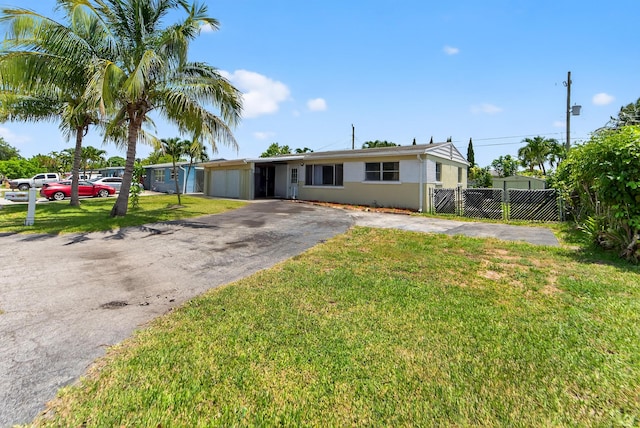 4364 N Mary Cir, Palm Beach Gardens, FL 33410 - view of front of property featuring asphalt driveway and stucco siding