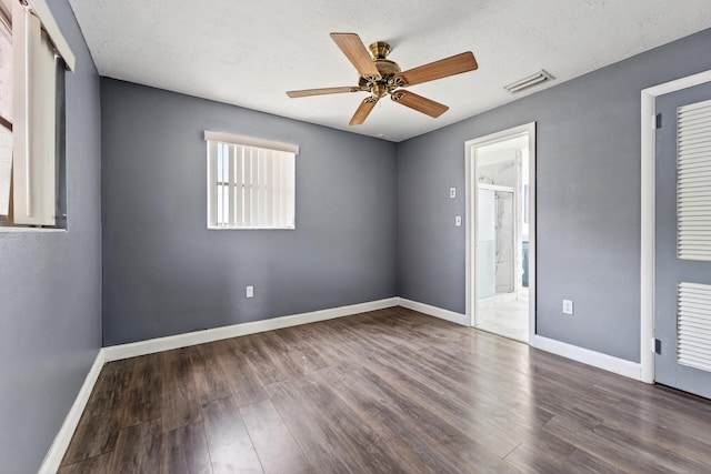 4364 N Mary Cir, Palm Beach Gardens, FL 33410 - empty room with wood finished floors, ceiling fan, and a textured ceiling
