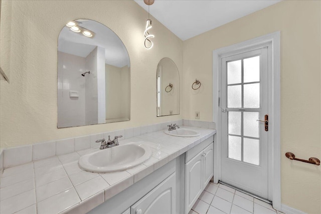 11061 NW 45th St, Coral Springs, FL 33065 - full bath with plenty of natural light, double vanity, tile patterned floors, and a shower