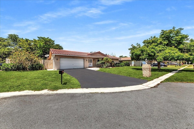 11061 NW 45th St, Coral Springs, FL 33065 - view of front facade with a garage, driveway, and a tiled roof