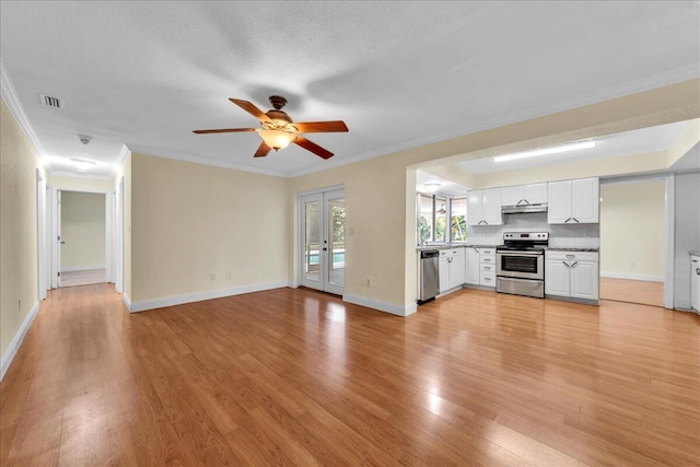 11061 NW 45th St, Coral Springs, FL 33065 - unfurnished living room with light wood-type flooring, ceiling fan, and crown molding