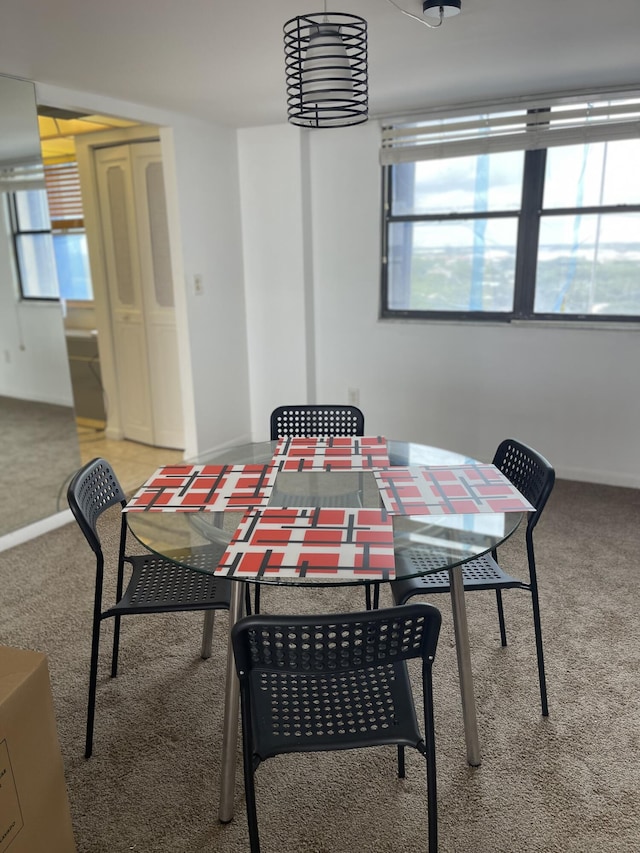 5200 N Flagler Dr Unit 1106, West Palm Beach, FL 33407 - dining space featuring carpet floors and baseboards