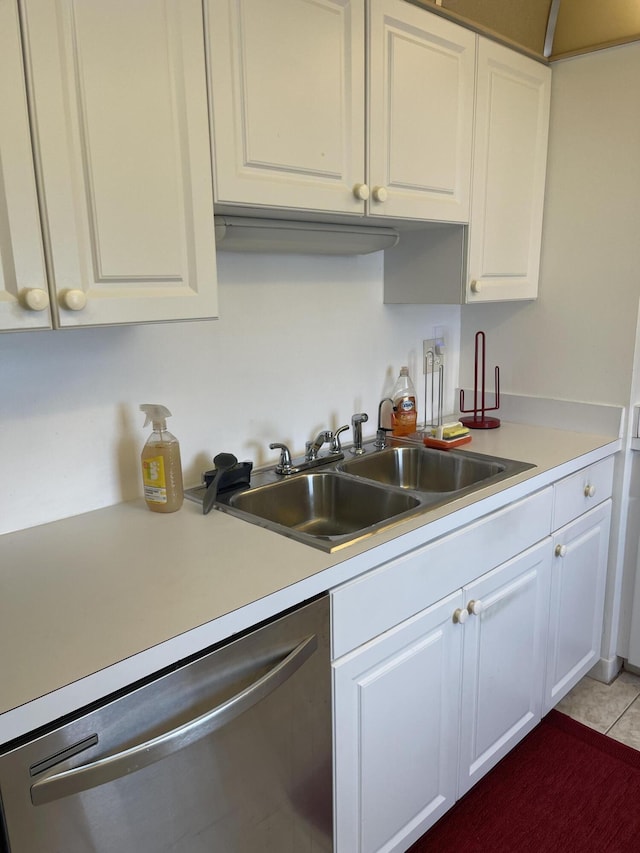 5200 N Flagler Dr Unit 1106, West Palm Beach, FL 33407 - kitchen with stainless steel dishwasher, white cabinets, light countertops, and light tile patterned floors