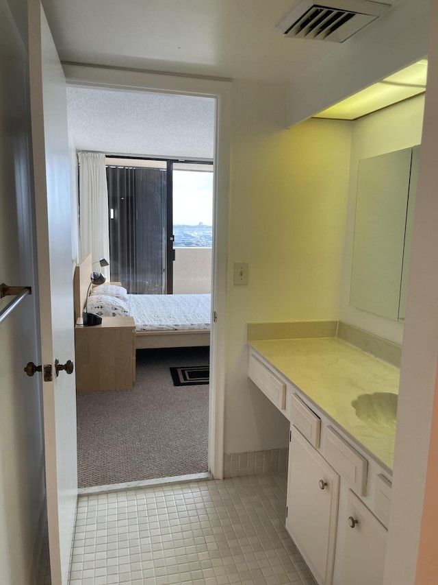 5200 N Flagler Dr Unit 1106, West Palm Beach, FL 33407 - bathroom featuring vanity and tile patterned flooring