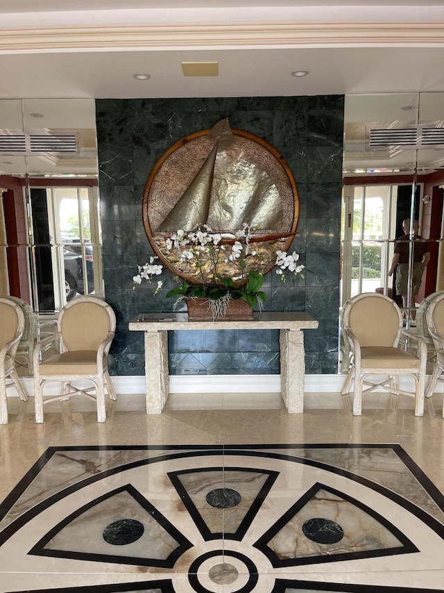 5200 N Flagler Dr Unit 1106, West Palm Beach, FL 33407 - corridor with inlaid floor details, ornamental molding, and marble tiled floors