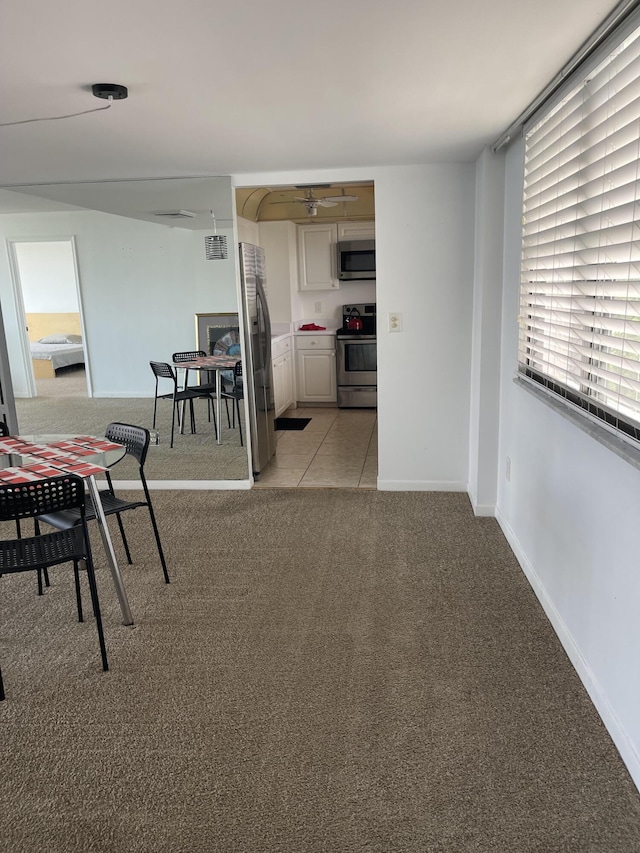 5200 N Flagler Dr Unit 1106, West Palm Beach, FL 33407 - dining space with light carpet and baseboards