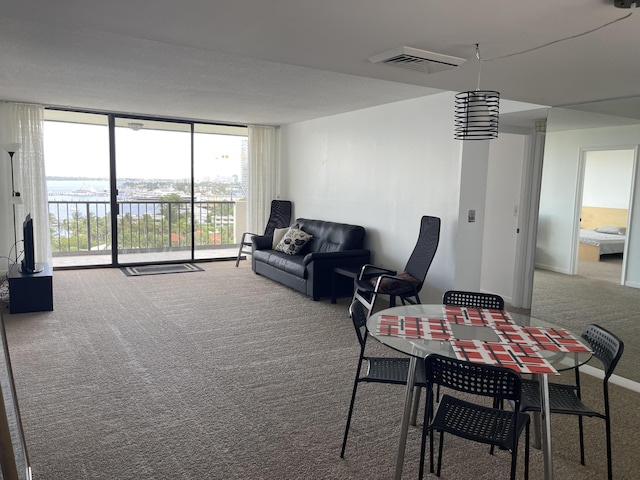 5200 N Flagler Dr Unit 1106, West Palm Beach, FL 33407 - dining space with carpet floors and floor to ceiling windows