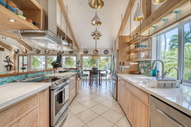 116 Dunes Edge Rd, Jupiter, FL 33477 - kitchen featuring appliances with stainless steel finishes, light brown cabinets, open shelves, plenty of natural light, and vaulted ceiling