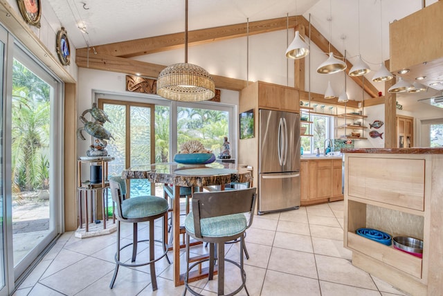 116 Dunes Edge Rd, Jupiter, FL 33477 - dining space with light tile patterned flooring, high vaulted ceiling, and beamed ceiling
