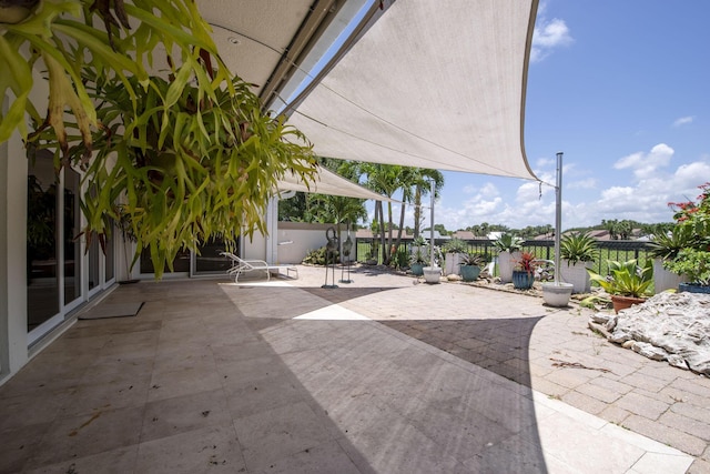 116 Dunes Edge Rd, Jupiter, FL 33477 - fenced backyard with a patio