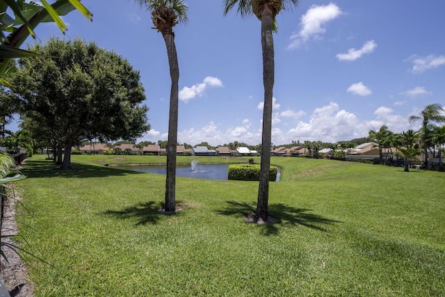 116 Dunes Edge Rd, Jupiter, FL 33477 - view of green lawn with a water view and a residential view