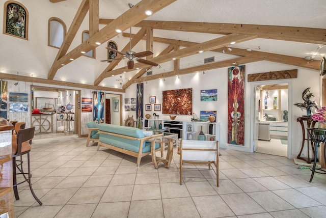 116 Dunes Edge Rd, Jupiter, FL 33477 - living room featuring beamed ceiling, light tile patterned floors, a ceiling fan, and high vaulted ceiling