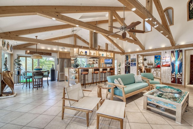 116 Dunes Edge Rd, Jupiter, FL 33477 - living room with light tile patterned flooring, beam ceiling, high vaulted ceiling, and a ceiling fan