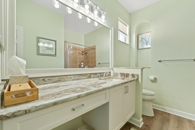 876 SW Rocky Bayou Ter, Port Saint Lucie, FL 34986 - full bath with vanity, wood finished floors, and a shower with shower curtain