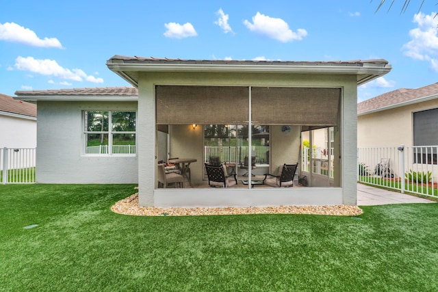 876 SW Rocky Bayou Ter, Port Saint Lucie, FL 34986 - back of house featuring a sunroom and stucco siding