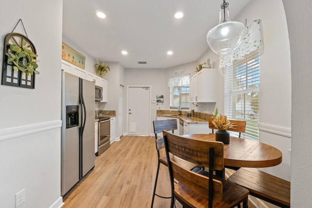 876 SW Rocky Bayou Ter, Port Saint Lucie, FL 34986 - dining space featuring recessed lighting and light wood-style floors